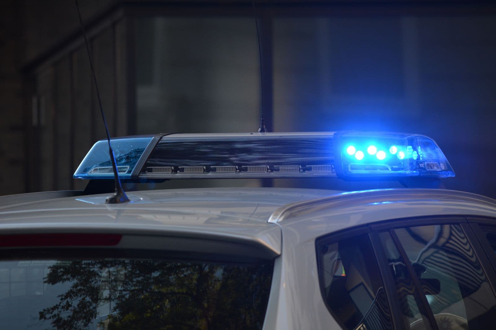Police vehicle light bar illuminated on a white cruiser