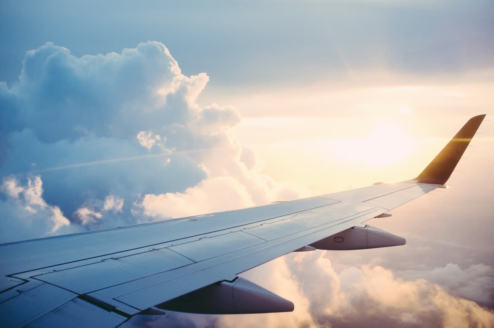 Commercial airplane taking off over a runway